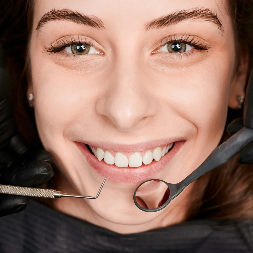 Patient smiling during dental examination with dentist at Homer Watson Dental