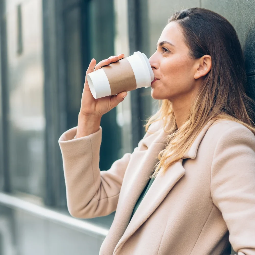 Woman drinking coffee, a common cause of teeth staining