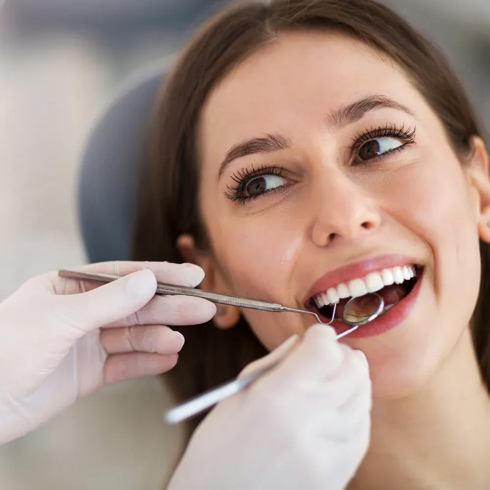 Patient receiving professional dental cleaning from hygienist