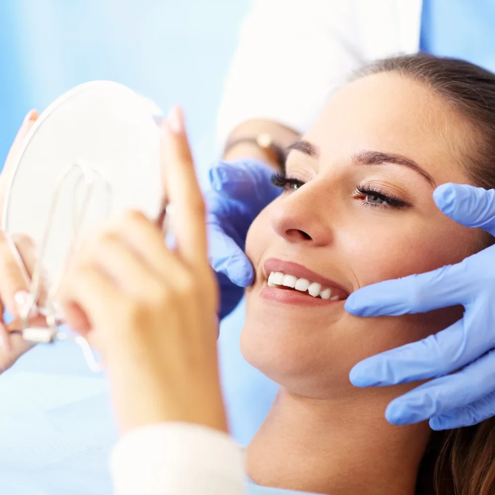 Patient smiling after comfortable root canal treatment at dental clinic