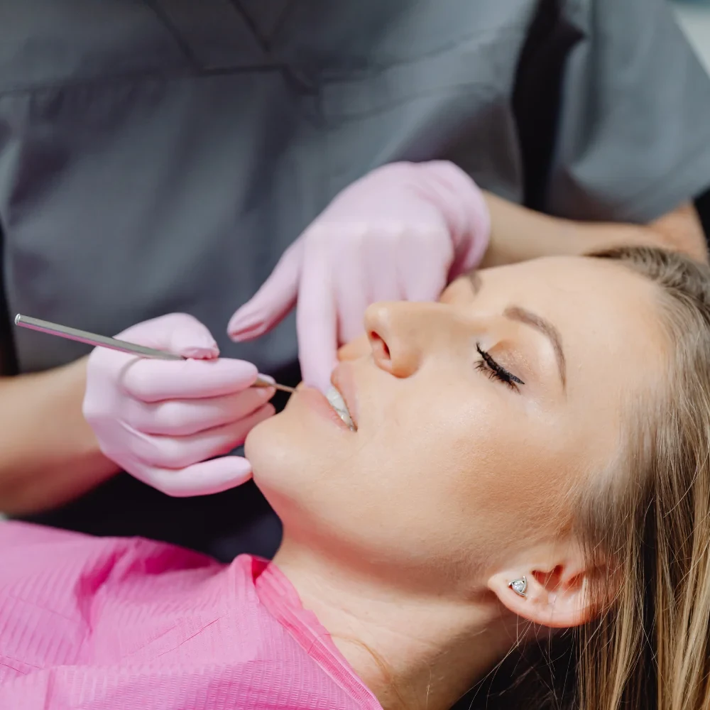 Relaxed patient undergoing dental treatment with sedation dentistry