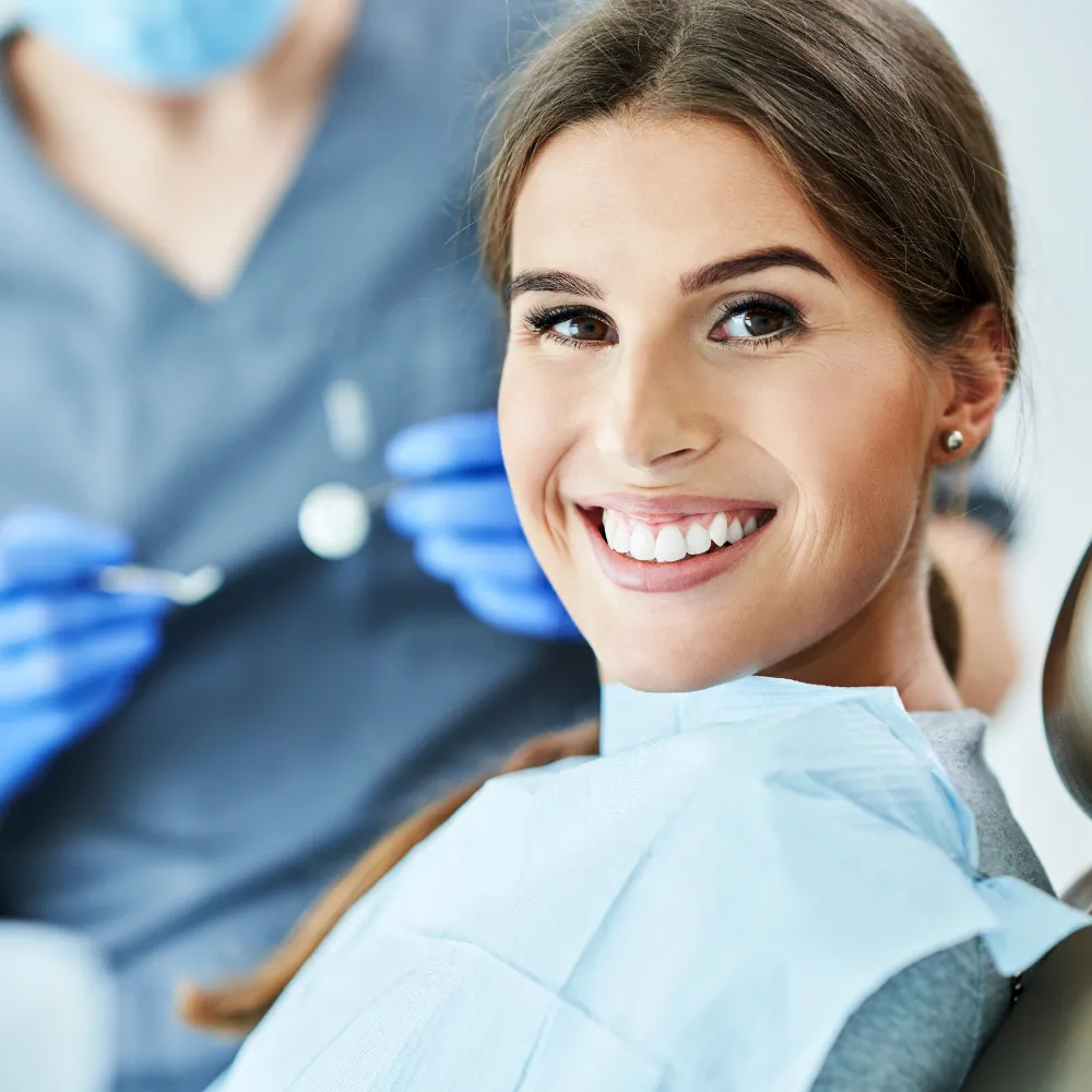 Patient smiling in dental chair during treatment at a Kitchener dental clinic