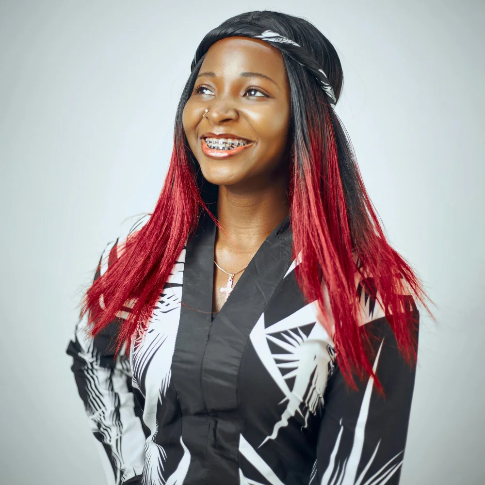 Teen patient smiling with braces during orthodontic treatment