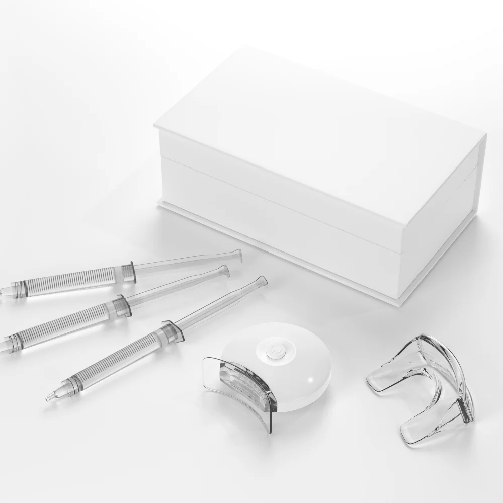 Professional teeth whitening kit with trays and syringes