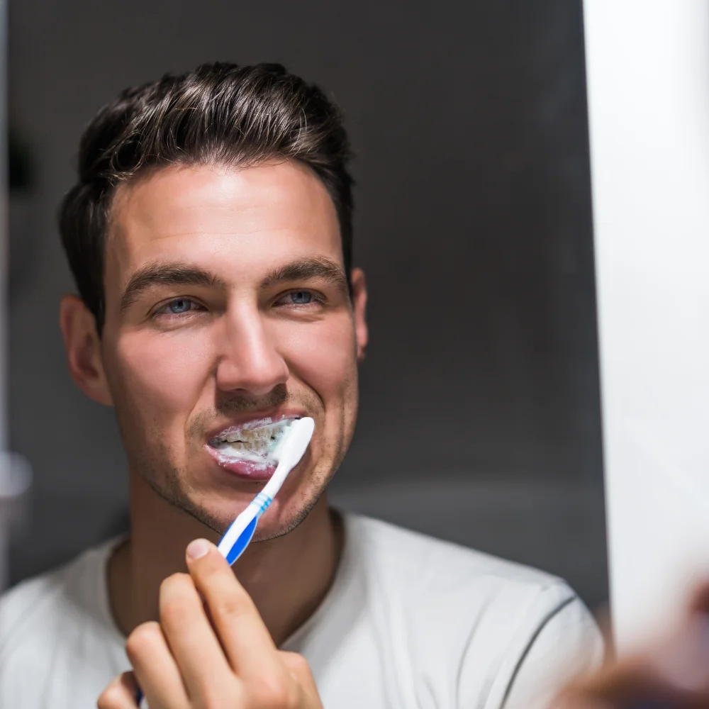 Brushing teeth to maintain results after whitening treatment in Kitchener